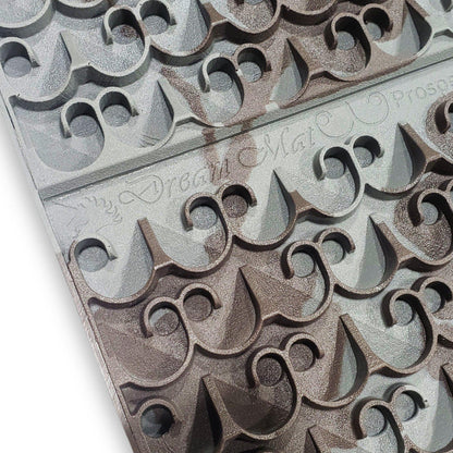 Close up of 12X24 Sluice Mat Mini Dream Mat showcasing raised curved riffles on a white background