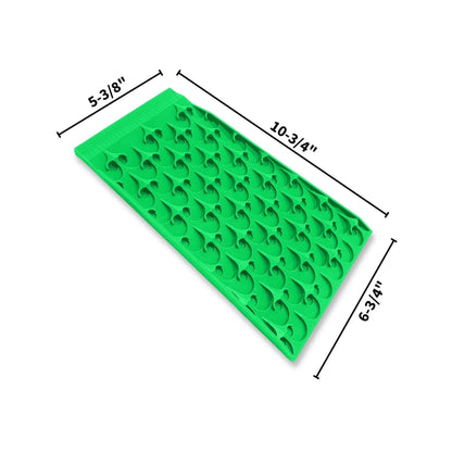 Angled view of the 5-3/8 x 6-3/4 x 10-3/4 Mini Dredge Bottom Mat with raised recovery channels on a white background