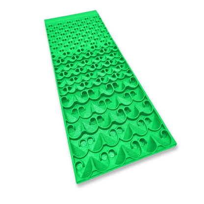 Angled view of 6X16 Combo Sluice Mat 2nd Gen Dream Mat showcasing raised riffle patterns on a white background