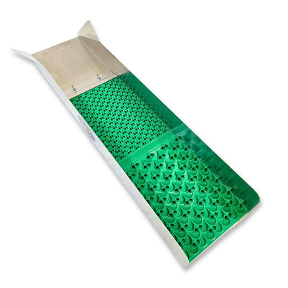 Metal gold panning sluice box with a bright green textured rubber mat inside, isolated on white.