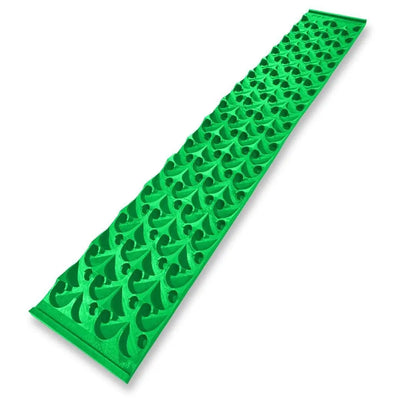 Angled view of 8X48 Dredge Dream Mat showcasing a green repeating textured pattern on a white background