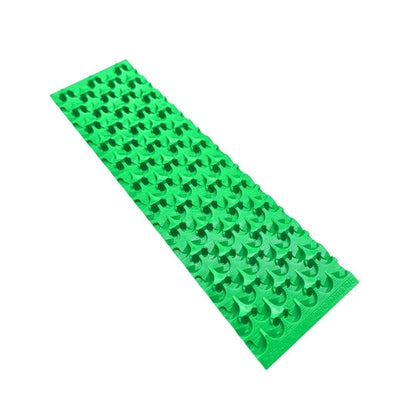 Angled view of Buddy Sluice Mat showcasing repeated raised riffle pattern with a white background