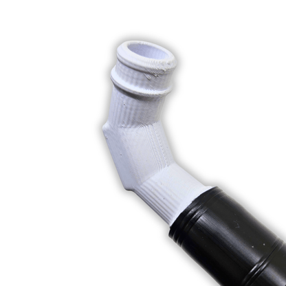 Close-up of Gold Clean Up Buddy 12V kit showing a white threaded elbow fitting attached to a black hose on white background