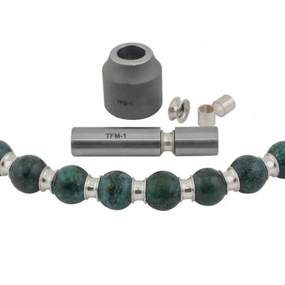 Close-up of tube flaring tool kit for bead spacers showing TFM-1 tools and green bead bracelet on white background