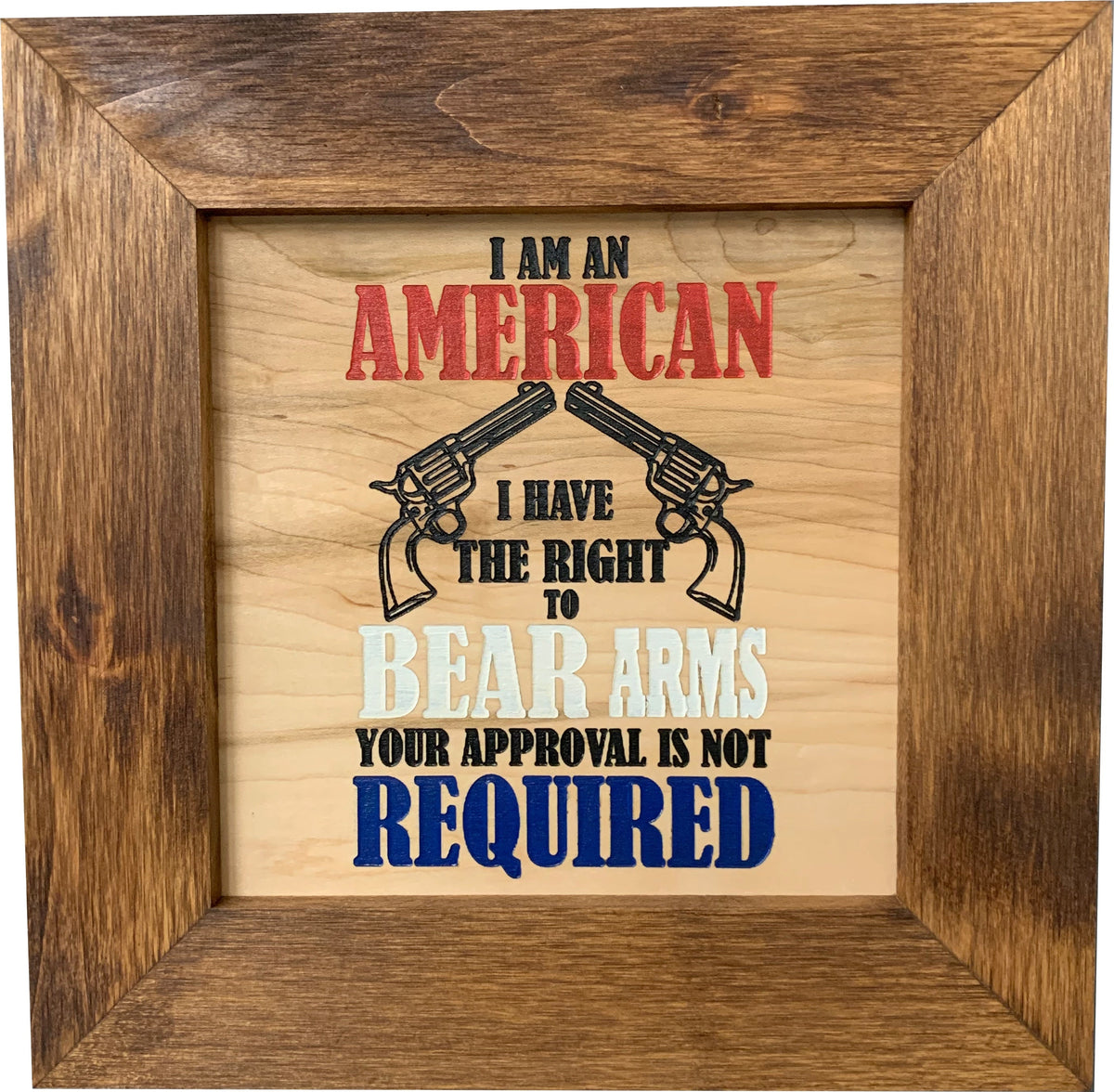 A square wooden sign with "I am an American, I have the right to bear arms, your approval is not required".