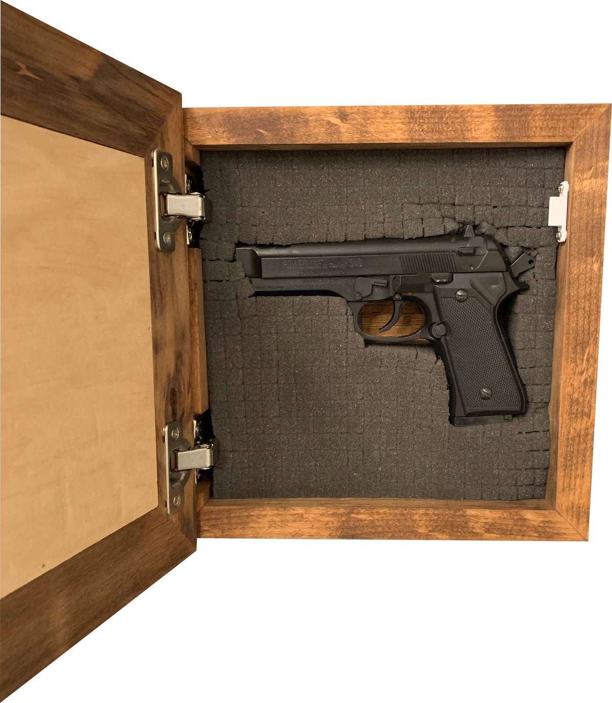 Wooden wall-mounted concealed gun safe with dark grey pluck foam lining a black pistol.
