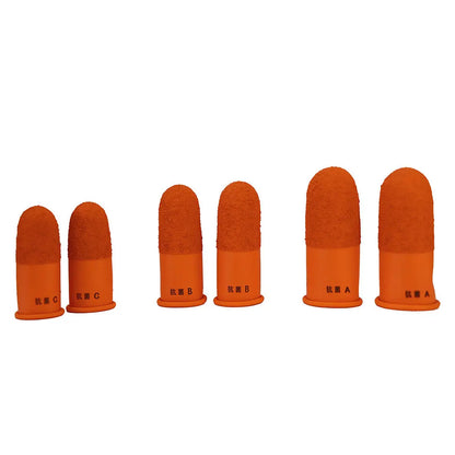 Front view of six orange Japanese rubber finger guards in A, B, and C sizes with antibacterial markings on a white background