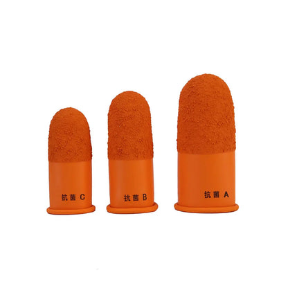 Front view of Japanese rubber finger guards showcasing three orange sizes with a white background