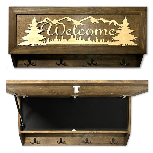 Brown wooden wall-mounted storage box with "Welcome" and mountain scene, four black hooks, and a felt-lined compartment.