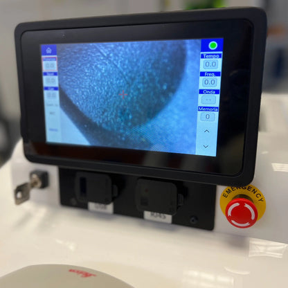 Close-up of Tauweld 225J benchtop laser welder showing touchscreen controls and emergency stop button