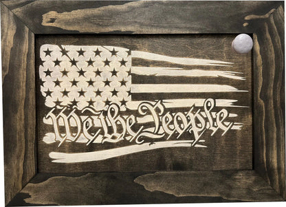 Front view of American flag gun cabinet showcasing black-and-white We the People design with dark wood frame