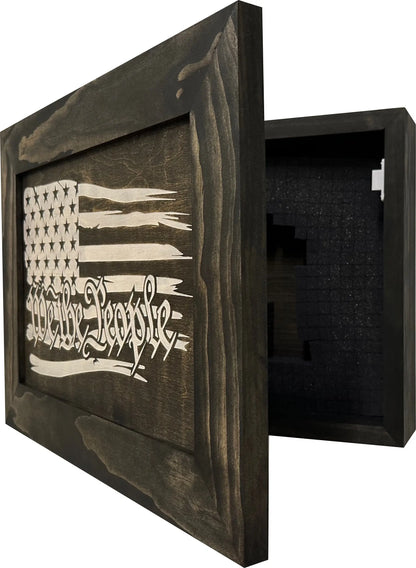 Partial open view of American Flag gun cabinet showcasing the We The People design and interior storage with white background