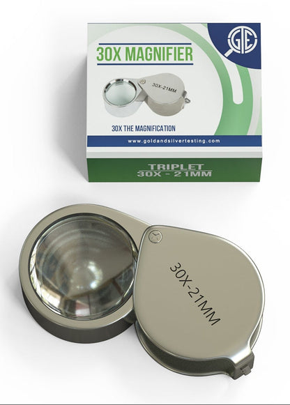 Front view of a 30X triplet loupe magnifier showcasing its 21 mm lens with product box on a white background