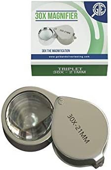 Close-up of a 30X triplet jeweler’s loupe showcasing its 21 mm lens with retail packaging on a white background