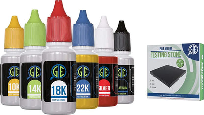 Front view of gold, silver, and platinum acid testing bottles with a boxed premium testing stone on a white background