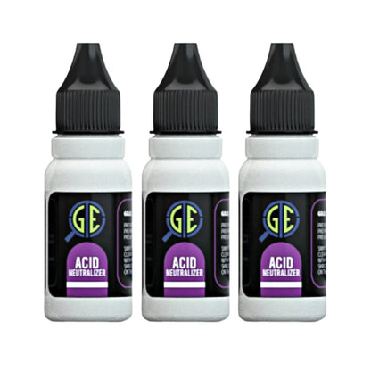 Front view of three gold testing acid neutralizer bottles with black caps and purple labels on a white background